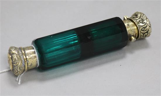 A Victorian silver gilt mounted green glass double-ended scent bottle.